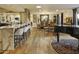 Open floor plan featuring a wet bar, fireplace, dining area, and hardwood floors throughout at 4836 E Moonlight Way, Paradise Valley, AZ 85253