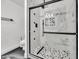 Modern bathroom with glass shower, mosaic tiled floor and black trim at 5728 E Sharon Dr, Scottsdale, AZ 85254