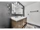 Bathroom with a double sink vanity, modern fixtures and decorative mirror at 5728 E Sharon Dr, Scottsdale, AZ 85254