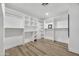 Large walk-in closet with built-in shelving and ample storage space at 5728 E Sharon Dr, Scottsdale, AZ 85254