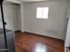 Bedroom with wood-look flooring and standard closet at 61 W Southern Ave # 31, Mesa, AZ 85210