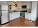 Modern kitchen with stainless steel appliances, white cabinetry, and stylish backsplash at 61 W Southern Ave # 31, Mesa, AZ 85210