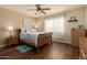 Cozy bedroom features natural light, ceiling fan and wood laminate flooring at 6160 S Pebble Beach Dr, Chandler, AZ 85249