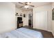 Bedroom with wood laminate flooring, ceiling fan and closet at 6160 S Pebble Beach Dr, Chandler, AZ 85249