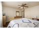 Bedroom with ceiling fan, wood laminate flooring and natural lighting at 6160 S Pebble Beach Dr, Chandler, AZ 85249