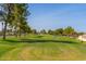 Beautiful SunBird Golf Course with lush green fairway lined with mature shade trees at 6160 S Pebble Beach Dr, Chandler, AZ 85249