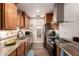 Stylish kitchen with granite countertops, stainless steel appliances, and tiled backsplash at 6160 S Pebble Beach Dr, Chandler, AZ 85249