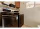 Modern laundry room with black Samsung washer and dryer at 6160 S Pebble Beach Dr, Chandler, AZ 85249