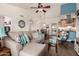 Open-concept living room with vaulted ceiling, modern furniture, and view of the kitchen and dining area at 6160 S Pebble Beach Dr, Chandler, AZ 85249