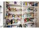 Well-stocked pantry featuring ample shelving for food storage and organizational solutions at 6160 S Pebble Beach Dr, Chandler, AZ 85249