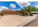 Spacious three-car garage and a well-maintained yard compliment this home's exterior at 725 S Canfield --, Mesa, AZ 85208