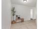 Hallway features tile floors, decorative bench, and a glimpse into a bathroom at 725 S Canfield --, Mesa, AZ 85208