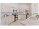 Modern kitchen with white countertops, stainless steel appliances, and double oven at 725 S Canfield --, Mesa, AZ 85208