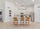 Spacious kitchen with white cabinets, stainless steel appliances, and a breakfast bar with seating at 725 S Canfield --, Mesa, AZ 85208