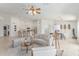 Spacious living room with an open floor plan, tile flooring, and seamless access to the kitchen and dining areas at 725 S Canfield --, Mesa, AZ 85208
