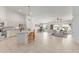 Open-concept living space featuring a kitchen island, dining area, and a comfortable seating area at 725 S Canfield --, Mesa, AZ 85208