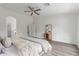 Spacious primary bedroom with hardwood floors and an open view to the ensuite bathroom at 725 S Canfield --, Mesa, AZ 85208