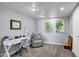 Finished basement includes a cozy sitting area, a desk, and carpeted flooring at 8034 E Del Caverna Dr, Scottsdale, AZ 85258