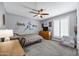 Bedroom with fan, neutral colors, and shuttered windows at 8034 E Del Caverna Dr, Scottsdale, AZ 85258
