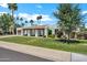 Charming single-story home featuring a well-manicured lawn and desert landscaping at 8034 E Del Caverna Dr, Scottsdale, AZ 85258