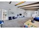 Bright living room with a vaulted ceiling, beams, and an open layout at 8034 E Del Caverna Dr, Scottsdale, AZ 85258