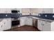 Beautiful kitchen with white cabinets, stainless appliances, and granite counters at 8500 W Saint John Rd, Peoria, AZ 85382