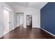 Large main bedroom featuring wood floors, closet space, and accent wall at 8500 W Saint John Rd, Peoria, AZ 85382
