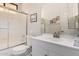 Clean bathroom featuring a white vanity, neutral fixtures, and tiled shower with glass doors at 9575 S Ash Ave, Tempe, AZ 85284