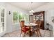 Cozy breakfast nook features natural light from the large window and traditional wooden furniture at 9575 S Ash Ave, Tempe, AZ 85284