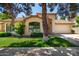 Charming single-story home with a well-manicured lawn, two-car garage, and a welcoming arched entryway at 9575 S Ash Ave, Tempe, AZ 85284