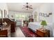 Bright bedroom with shutters, vaulted ceilings and access to an ensuite bathroom at 9575 S Ash Ave, Tempe, AZ 85284