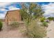 Desert landscaping surrounds this single Gathering home at 980 W Prior Ave, Coolidge, AZ 85128