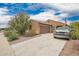 Attractive home featuring desert landscaping and a spacious driveway at 980 W Prior Ave, Coolidge, AZ 85128