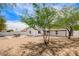 Backyard with desert landscaping featuring a patio set and shade trees at 9855 S 47Th Pl, Phoenix, AZ 85044