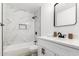 Bright bathroom featuring marbled shower, black hardware, and modern vanity at 9855 S 47Th Pl, Phoenix, AZ 85044