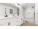 Modern bathroom featuring double vanity, marble style shower, and sleek fixtures at 9855 S 47Th Pl, Phoenix, AZ 85044