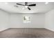 Bedroom with neutral carpet, ceiling fan, and bright window view at 9855 S 47Th Pl, Phoenix, AZ 85044