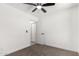 Carpeted bedroom showcasing ceiling fan, and ensuite bathroom at 9855 S 47Th Pl, Phoenix, AZ 85044