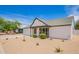 Inviting single-story home with a well-kept lawn and a comfortable front porch at 9855 S 47Th Pl, Phoenix, AZ 85044