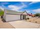 Beautiful single-story house featuring a spacious driveway and attached two-car garage at 9855 S 47Th Pl, Phoenix, AZ 85044
