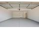 A two-car garage with an epoxy floor and water heater at 9855 S 47Th Pl, Phoenix, AZ 85044