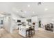 Modern kitchen with white cabinetry, a center island with seating, and stainless steel appliances at 9855 S 47Th Pl, Phoenix, AZ 85044
