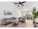 Bright living room with stylish sofas, neutral rug, and large windows, creating an inviting space at 9855 S 47Th Pl, Phoenix, AZ 85044