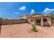 This backyard features low-maintenance landscaping and a covered patio at 11139 W Devonshire Ave, Phoenix, AZ 85037