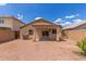Backyard featuring a covered patio and low maintenance landscaping at 11139 W Devonshire Ave, Phoenix, AZ 85037