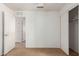 The bedroom features neutral carpet, white walls, and closet with sliding doors at 11139 W Devonshire Ave, Phoenix, AZ 85037