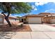 Charming single-Gathering home featuring a two-car garage, desert landscaping, and a spacious front yard at 11139 W Devonshire Ave, Phoenix, AZ 85037