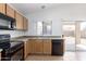 A bright kitchen with updated appliances, plenty of counter space, and access to the backyard at 11139 W Devonshire Ave, Phoenix, AZ 85037