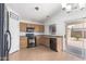 Functional kitchen with stainless steel appliances, ample cabinet space, and tile flooring at 11139 W Devonshire Ave, Phoenix, AZ 85037