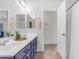 Bright bathroom with a double sink vanity, elegant mirrors, and a separate shower area at 11159 E Sebring Ave, Mesa, AZ 85212